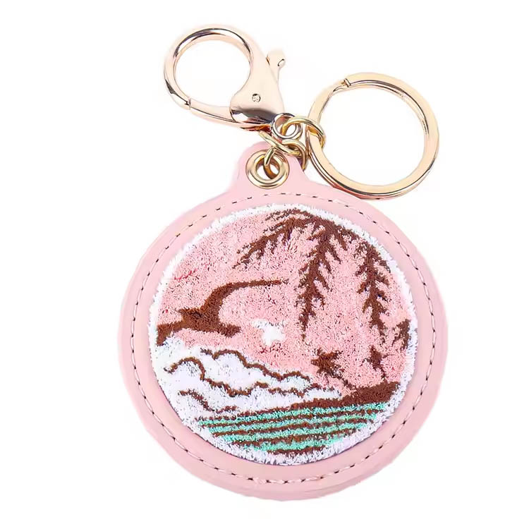 Avain Ring Pink Islandin maisemat Premium -kirjonta avaimenemä